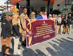 Gaungkan Pilkada Bahagia, KPU Sulteng Bagi-bagi Bunga dan Coklat